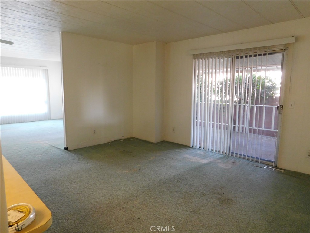 10675 Bryant Street, Unit 112 Yucaipa, CA 92399 - Photo 12 of 49 an empty room with windows