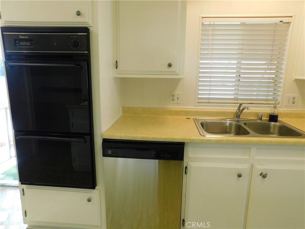 10675 Bryant Street, Unit 112 Yucaipa, CA 92399 - Photo 21 of 49 a bathroom with a sink and a shower