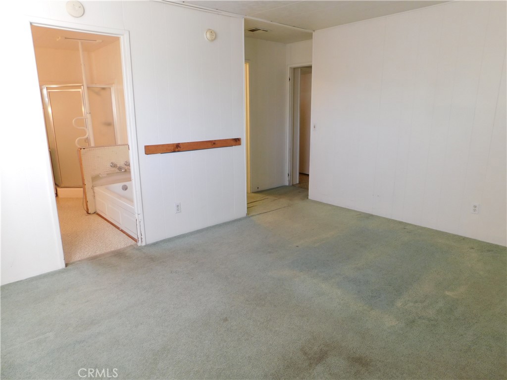 10675 Bryant Street, Unit 112 Yucaipa, CA 92399 - Photo 29 of 49 an empty room with a door