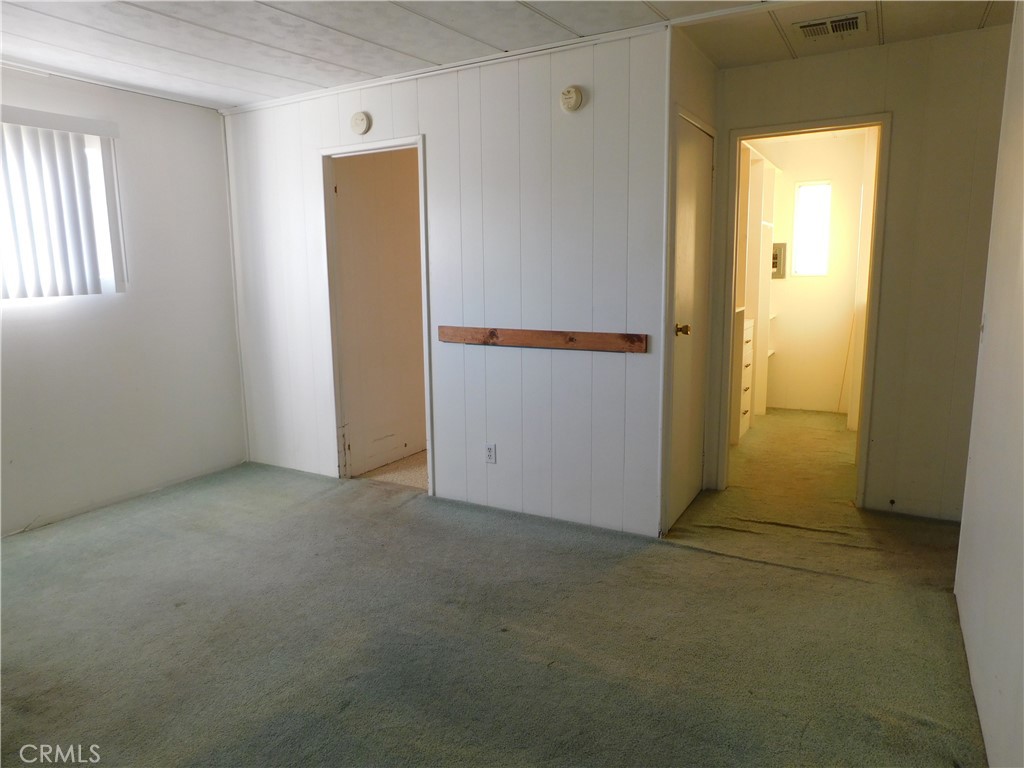 10675 Bryant Street, Unit 112 Yucaipa, CA 92399 - Photo 30 of 49 an empty room with windows