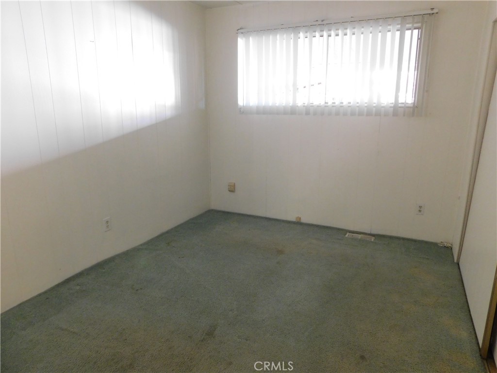 10675 Bryant Street, Unit 112 Yucaipa, CA 92399 - Photo 38 of 49 an empty room with a window