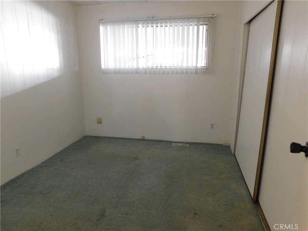 10675 Bryant Street, Unit 112 Yucaipa, CA 92399 - Photo 39 of 49 an empty room with windows