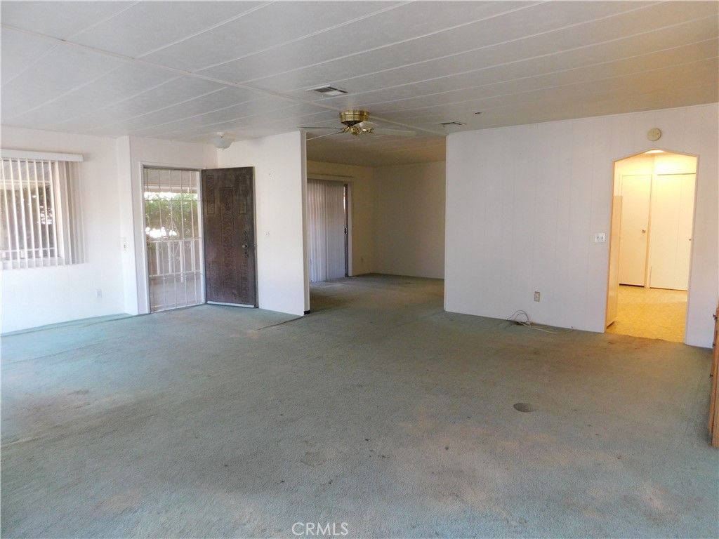 10675 Bryant Street, Unit 112 Yucaipa, CA 92399 - Photo 8 of 49 a view of an empty room with a window