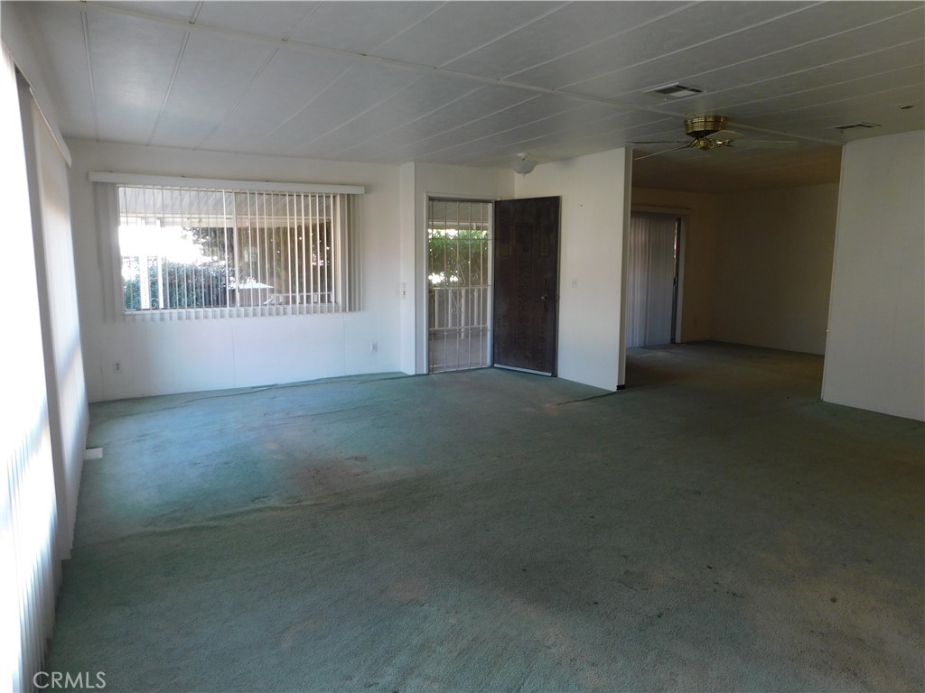 10675 Bryant Street, Unit 112 Yucaipa, CA 92399 - Photo 9 of 49 an empty room with windows