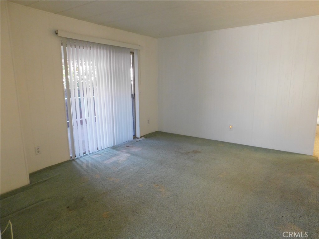 10675 Bryant Street, Unit 112 Yucaipa, CA 92399 - Photo 10 of 49 an empty room with windows