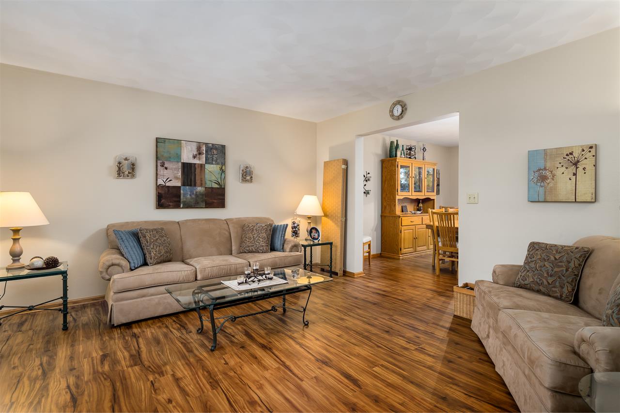 9414 Rambouillet Ridge Roscoe, IL 61073 - Photo 14 of 39 a living room with furniture and a wooden floor