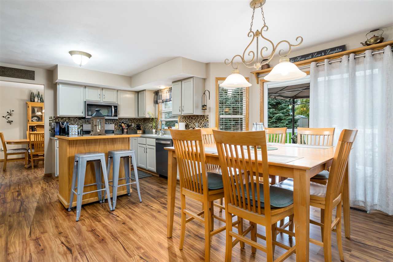 9414 Rambouillet Ridge Roscoe, IL 61073 - Photo 23 of 39 a view of a dining room with furniture window and outside view