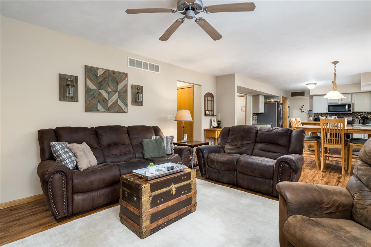 9414 Rambouillet Ridge Roscoe, IL 61073 - Photo 26 of 39 a living room with furniture and a ceiling fan