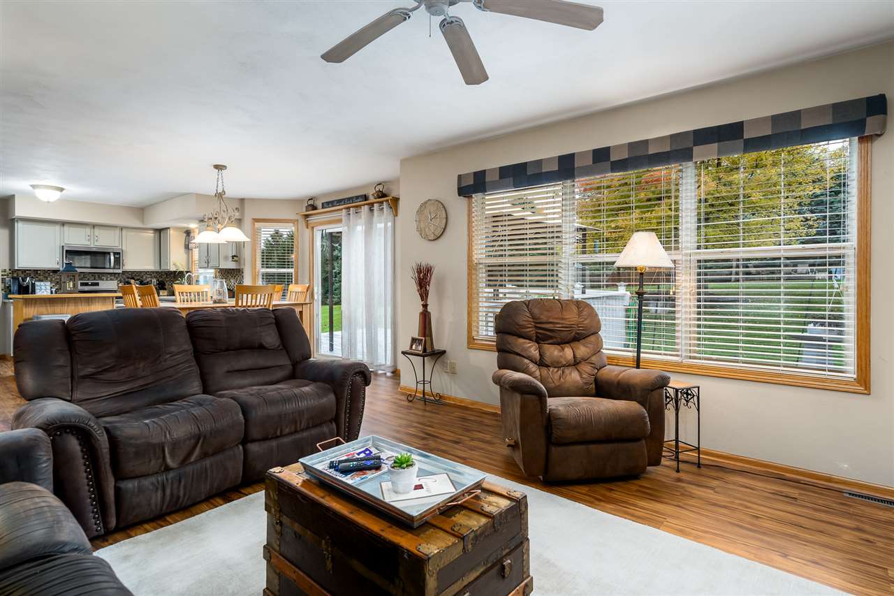 9414 Rambouillet Ridge Roscoe, IL 61073 - Photo 27 of 39 a living room with furniture and a large window