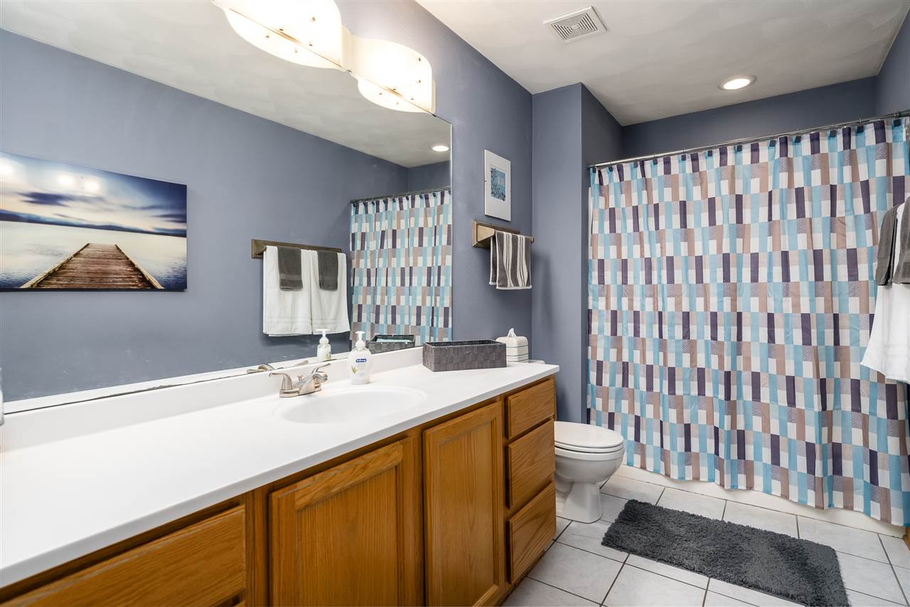 9414 Rambouillet Ridge Roscoe, IL 61073 - Photo 36 of 39 a bathroom with a sink a toilet and shower