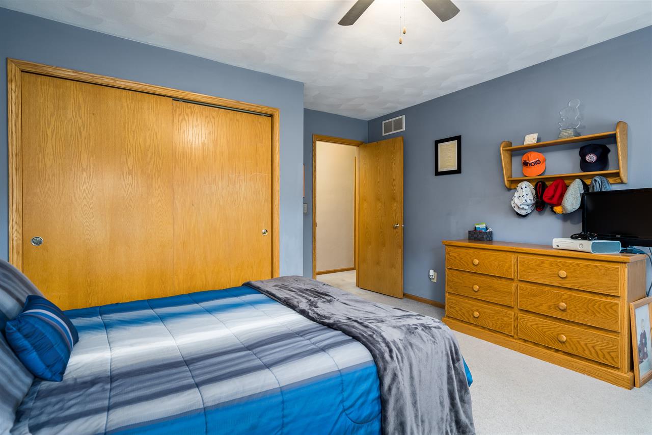 9414 Rambouillet Ridge Roscoe, IL 61073 - Photo 38 of 39 a bedroom with a bed and a window
