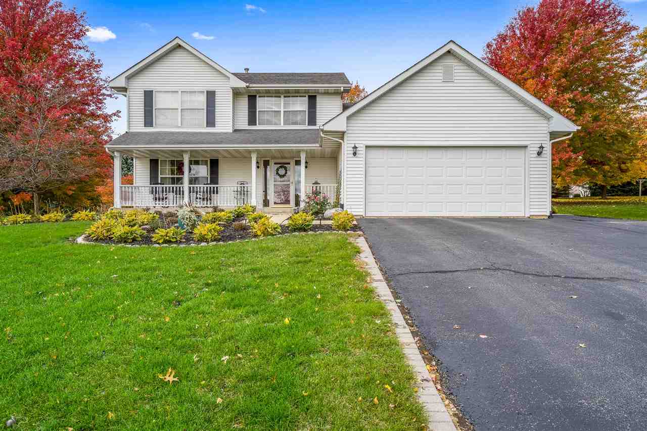 9414 Rambouillet Ridge Roscoe, IL 61073 - Photo 4 of 39 a front view of a house with garden