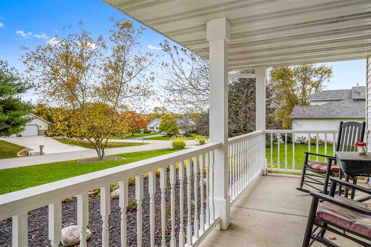 9414 Rambouillet Ridge Roscoe, IL 61073 - Photo 6 of 39 a view of a patio with a table & chairs
