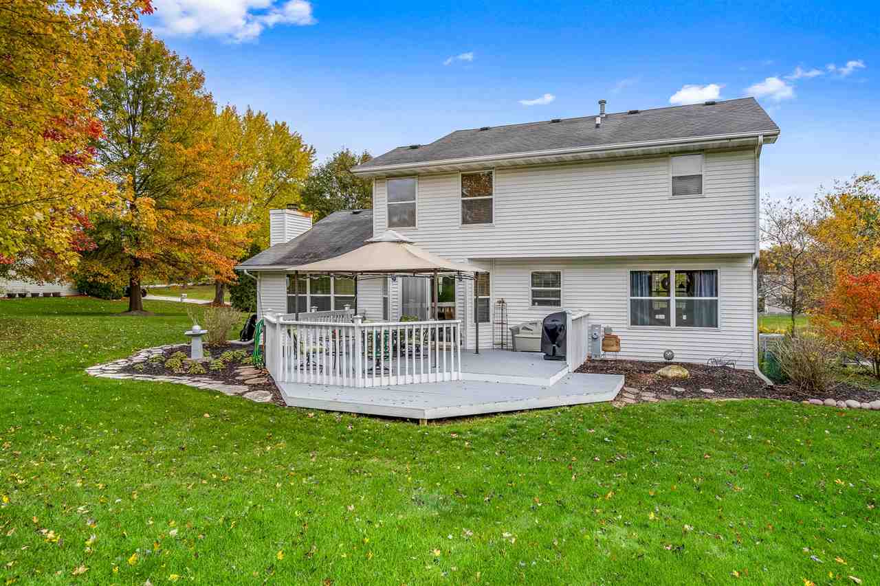 9414 Rambouillet Ridge Roscoe, IL 61073 - Photo 9 of 39 a view of a house with a yard and sitting area