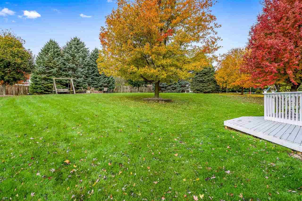 9414 Rambouillet Ridge Roscoe, IL 61073 - Photo 10 of 39 a view of a house with a yard