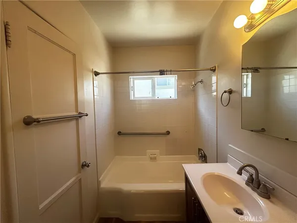 a bathroom with a sink and a bathtub