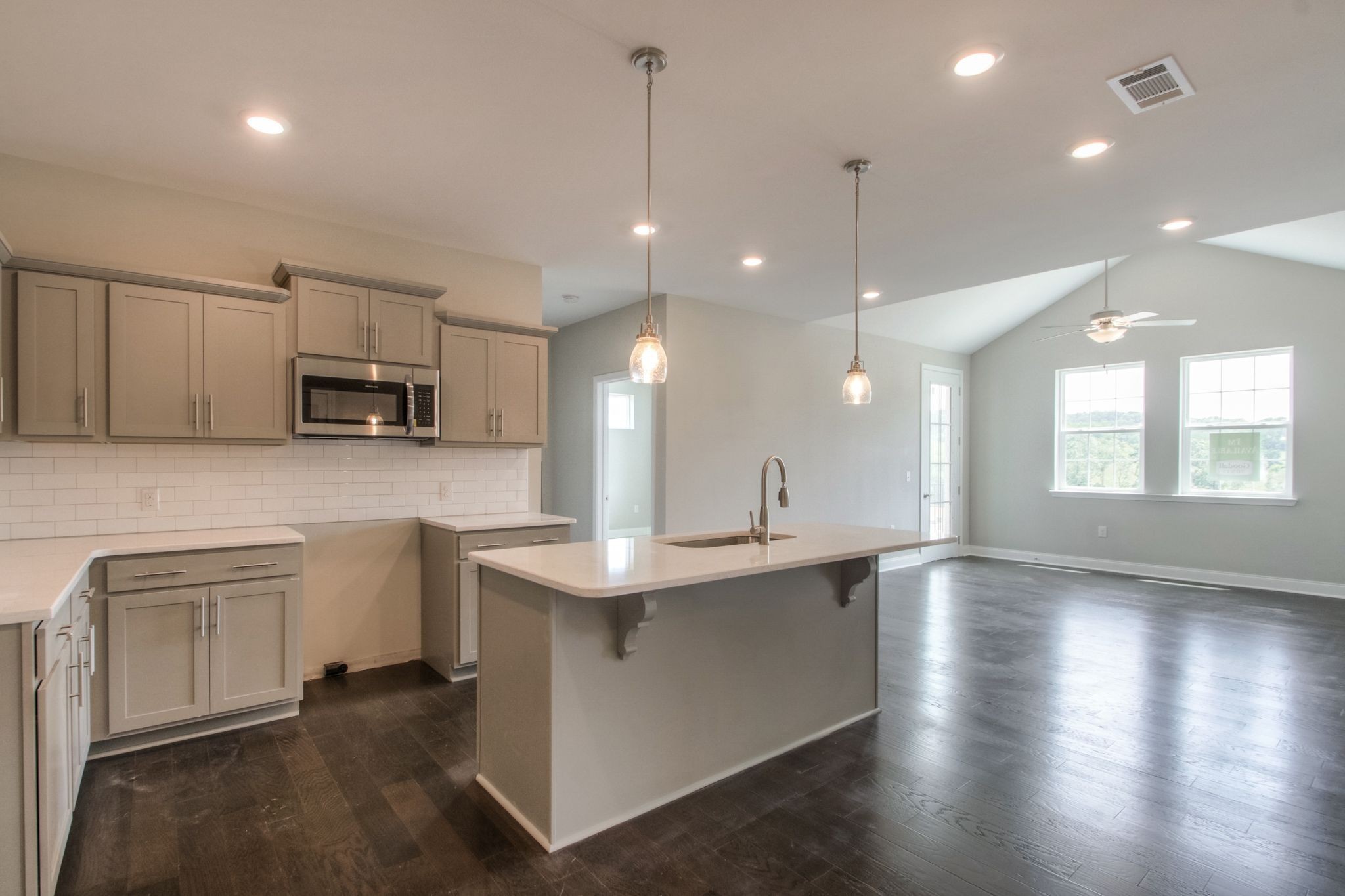 4000 Shadow Green Drive, Unit 4305 Franklin, TN 37064 - Photo 8 of 24 a kitchen with kitchen island a sink stainless steel appliances and cabinets