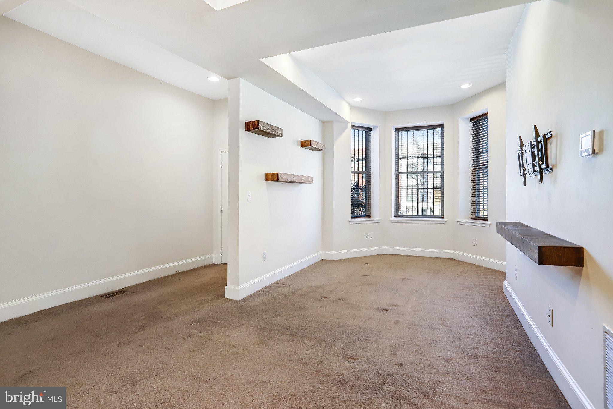 12 Rhode Island Avenue Northwest Washington, DC 20001 - Photo 6 of 74 Living area with floating shelves