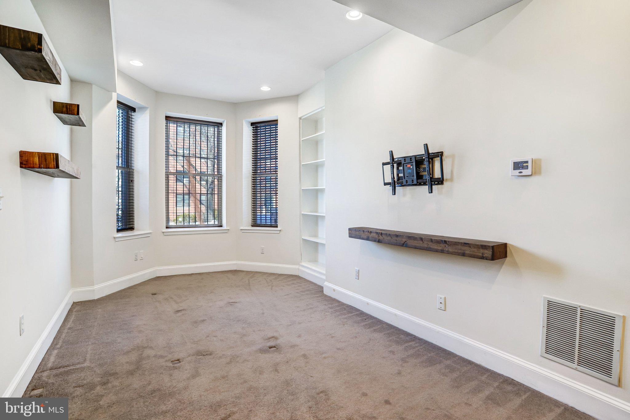 12 Rhode Island Avenue Northwest Washington, DC 20001 - Photo 7 of 74 TV Mount and built-in bookcase