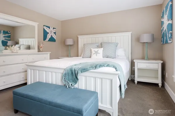 a bedroom with a bed and a dresser