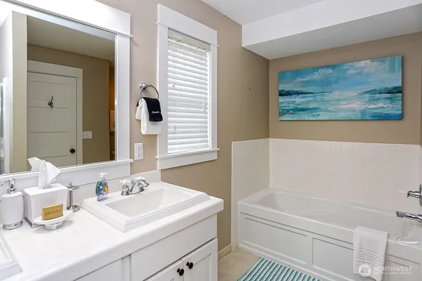 a bathroom with a sink and a bathtub