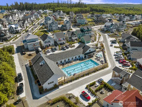an aerial view of a residential houses with outdoor space