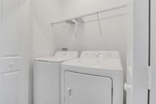 a utility room with dryer and washer