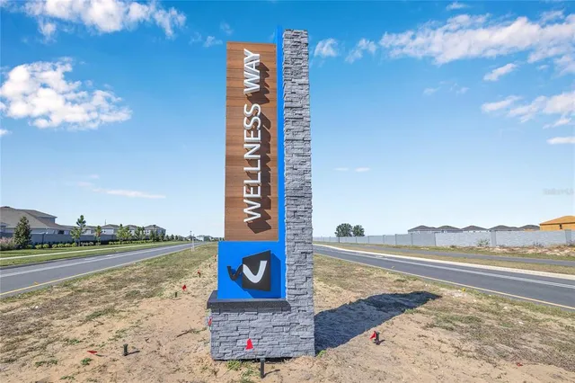 a front view of a building with a garden