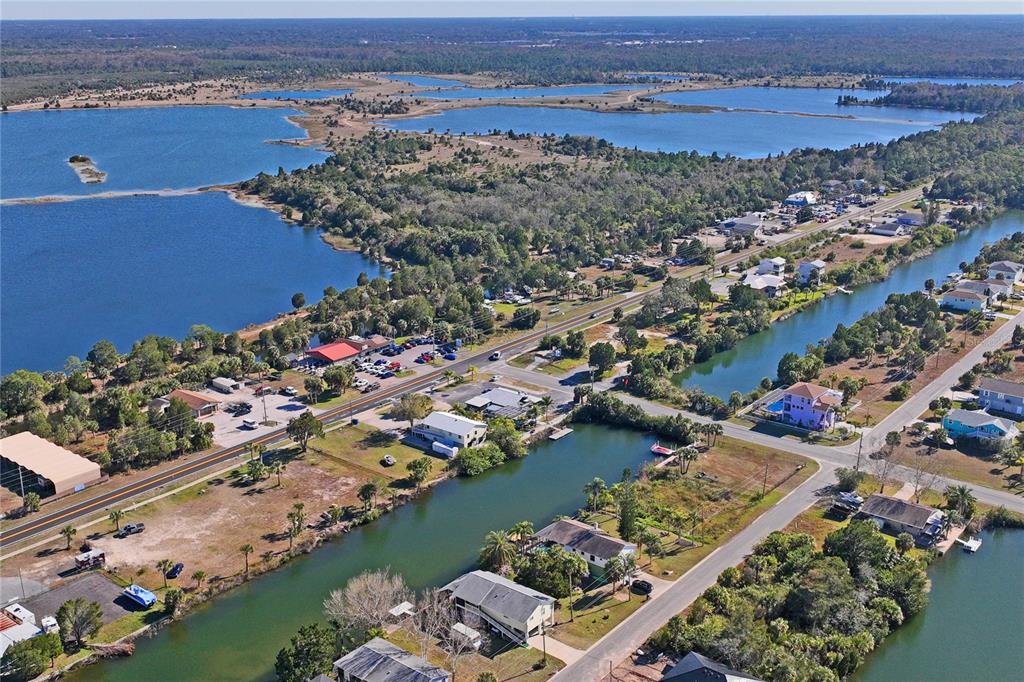 3344 Fernleaf Drive Hernando Beach, FL 34607 - Photo 17 of 22 an aerial view of lake and residential houses with outdoor space