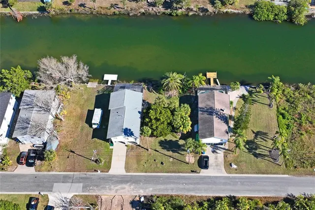 an aerial view of a house with a lake view