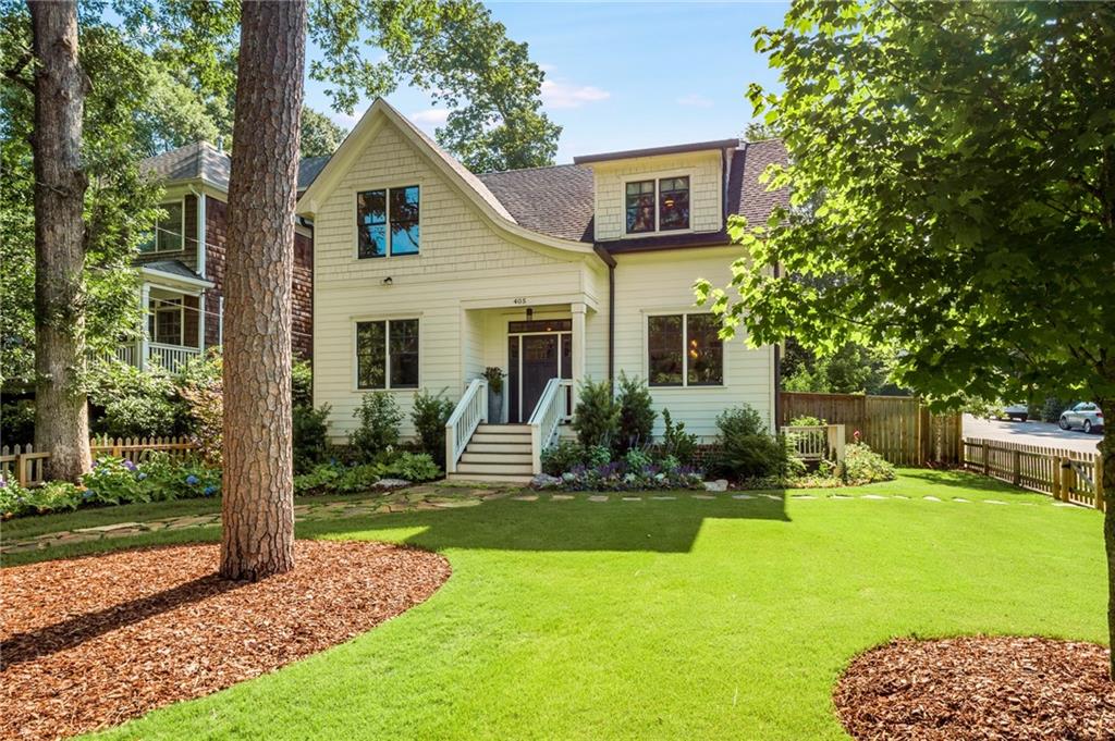 a front view of a house with a yard table and chairs