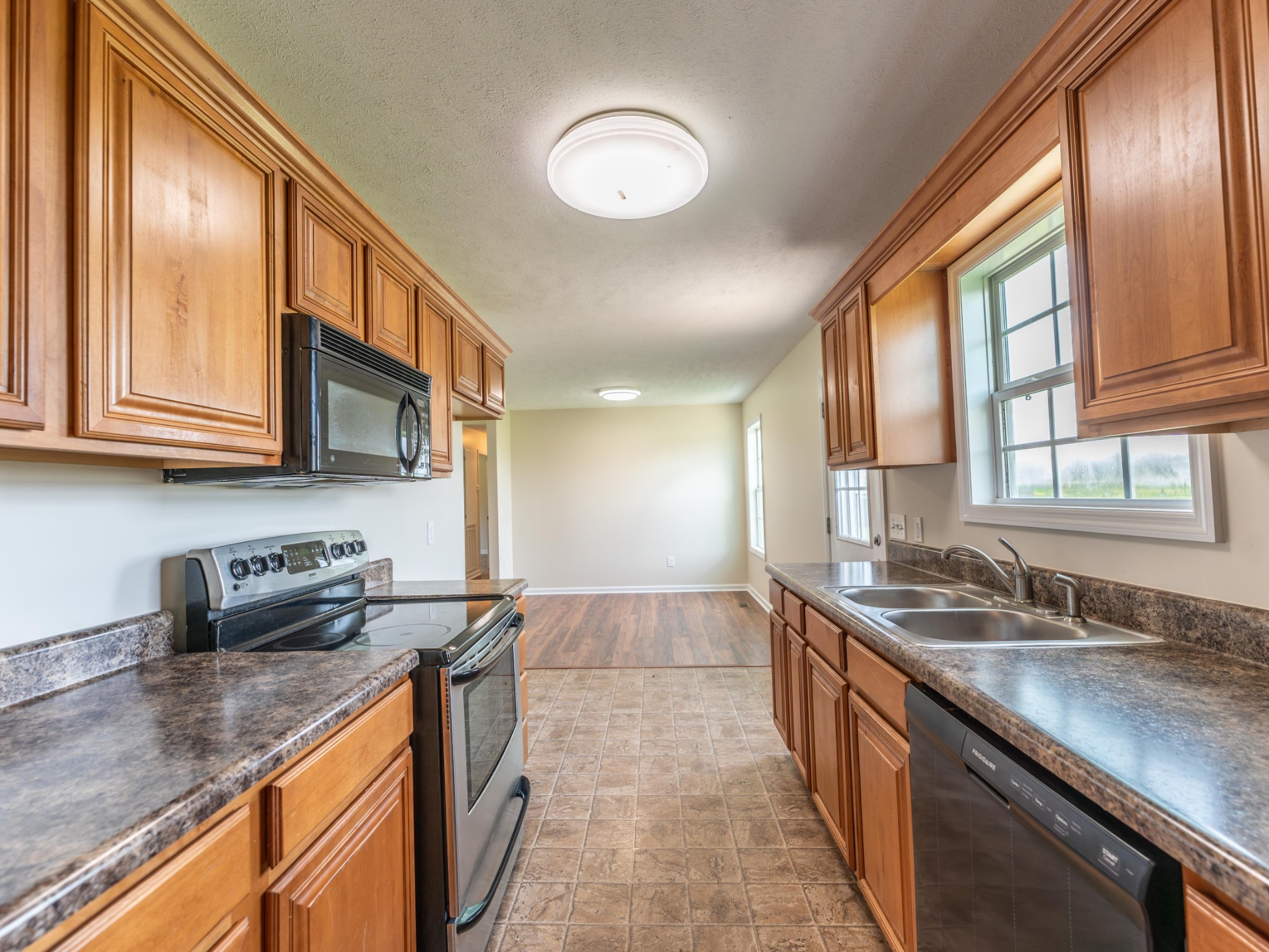 4214 Thick Road Chapel Hill, TN 37034 - Photo 12 of 29 a kitchen with stainless steel appliances granite countertop a sink stove and cabinets