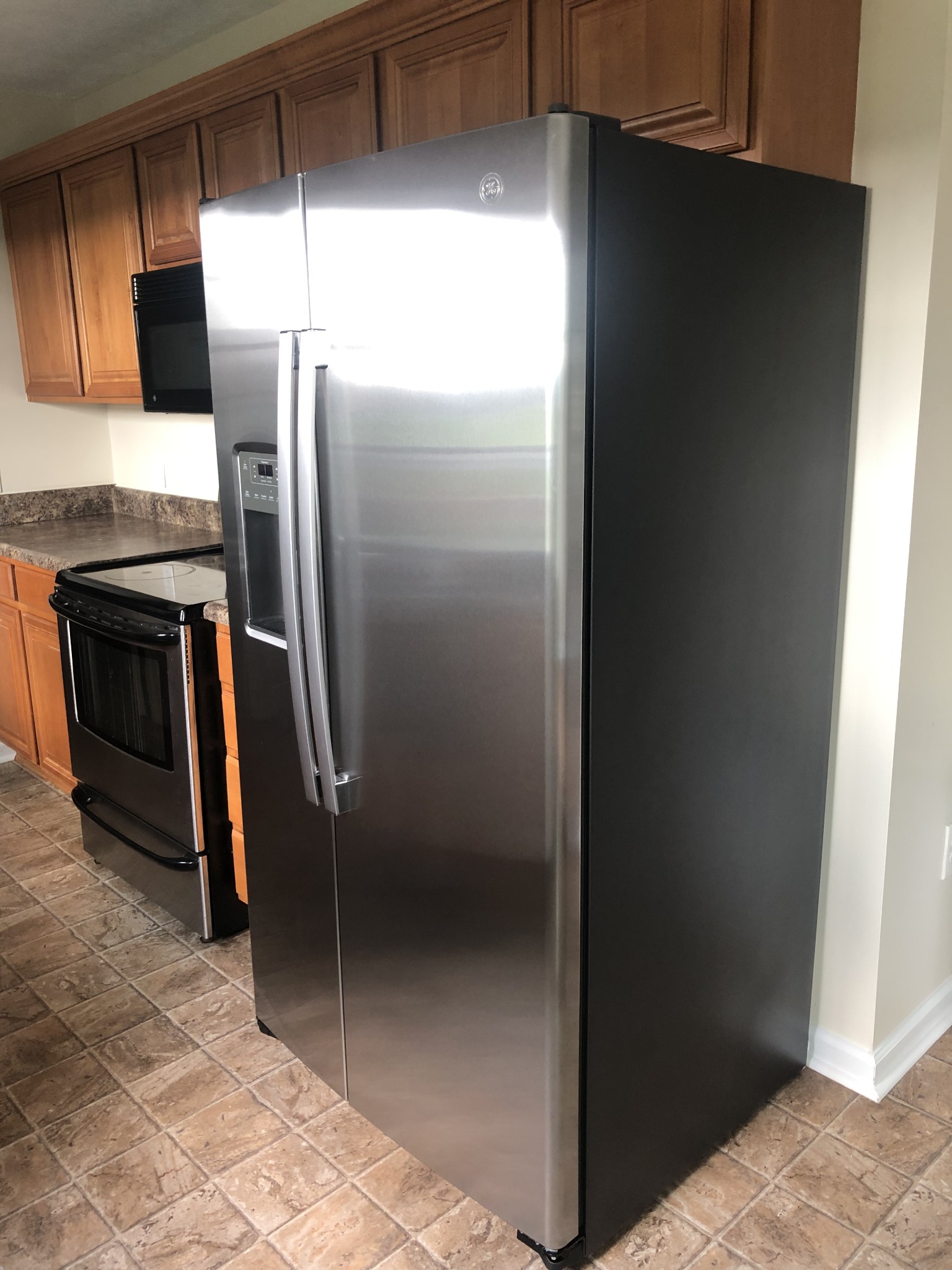4214 Thick Road Chapel Hill, TN 37034 - Photo 13 of 29 a metallic refrigerator freezer sitting in a kitchen
