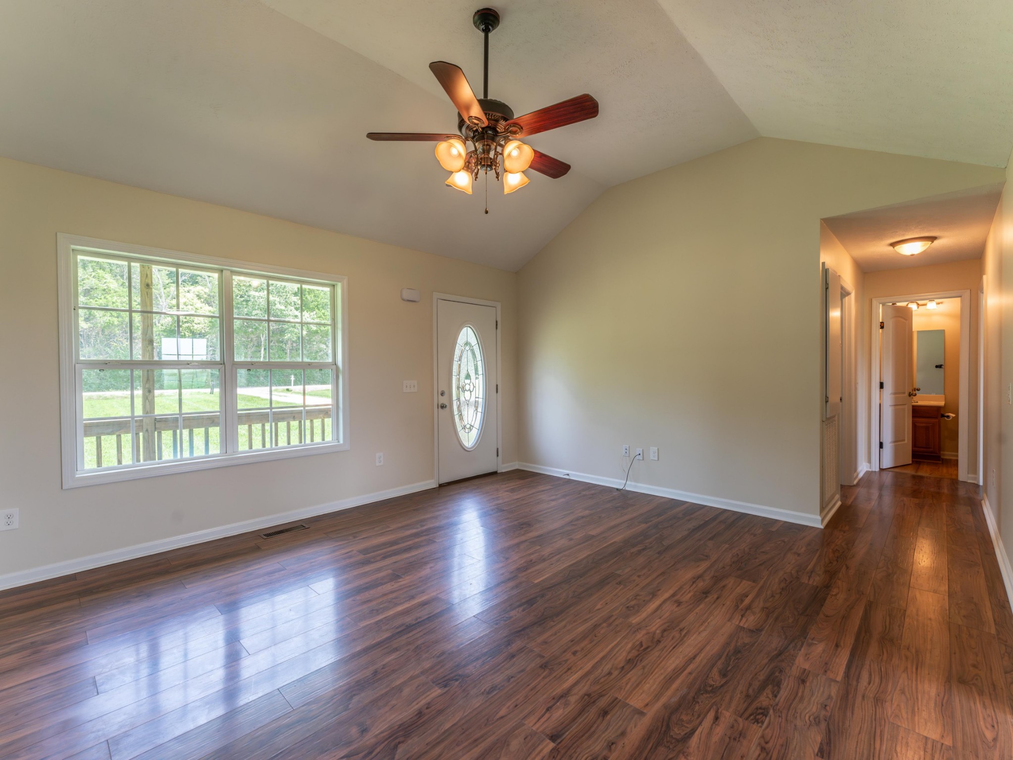 4214 Thick Road Chapel Hill, TN 37034 - Photo 9 of 29 a view of an empty room with wooden floor and a window