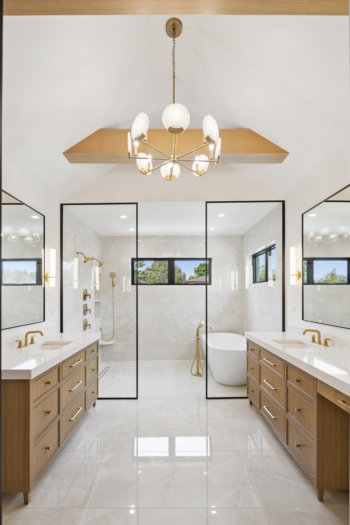 196 Walnut Street Elmhurst, IL 60126 - Photo 12 of 37 a spacious bathroom with a double vanity sink mirror and bathtub