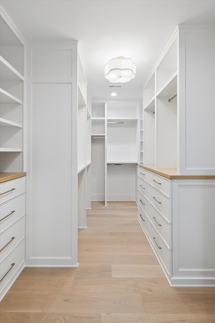 196 Walnut Street Elmhurst, IL 60126 - Photo 15 of 37 a view of walk in closet with empty racks