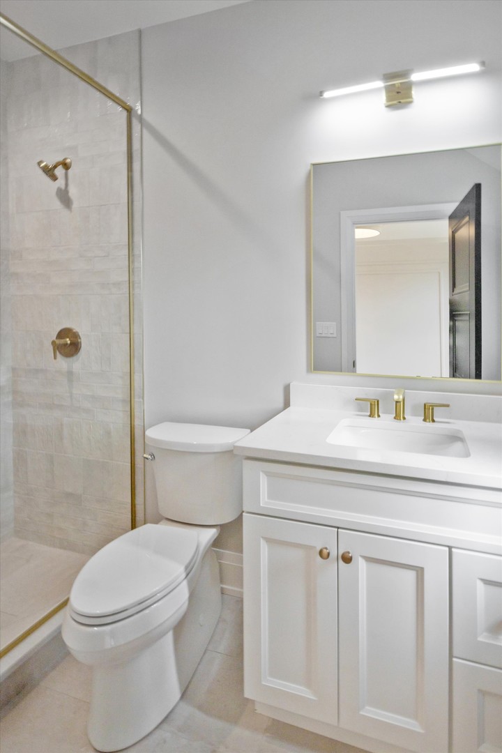 196 Walnut Street Elmhurst, IL 60126 - Photo 23 of 37 a bathroom with a sink a toilet and shower