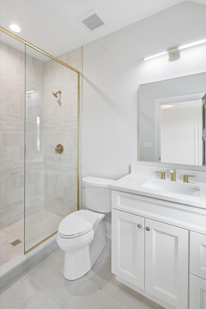196 Walnut Street Elmhurst, IL 60126 - Photo 24 of 37 a bathroom with a shower sink vanity mirror and toilet