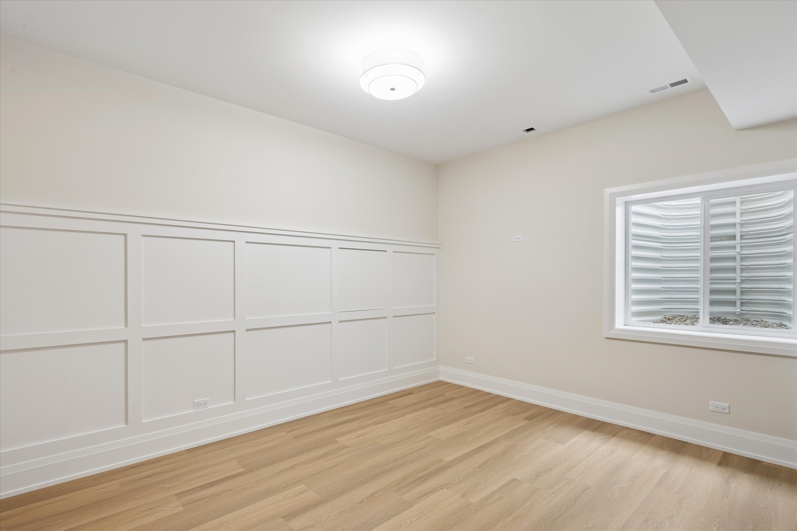 196 Walnut Street Elmhurst, IL 60126 - Photo 26 of 37 an empty room with wooden floor and windows