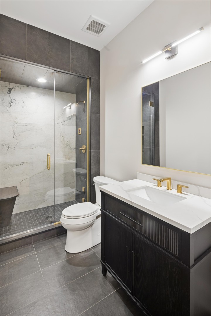 196 Walnut Street Elmhurst, IL 60126 - Photo 27 of 37 a bathroom with a sink toilet and shower