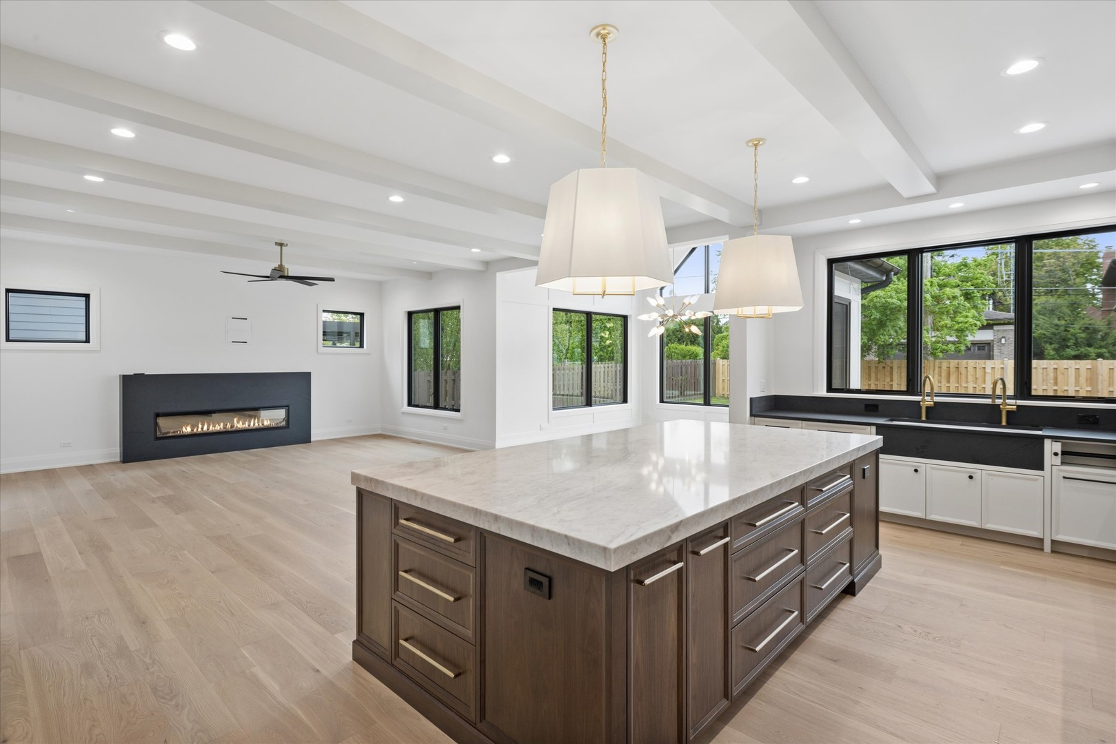 196 Walnut Street Elmhurst, IL 60126 - Photo 8 of 37 an open kitchen with a sink and dishwasher with wooden floor