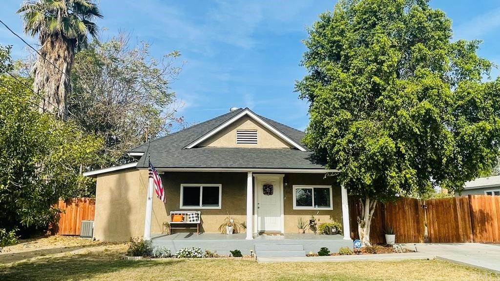 5107 Sierra Street Riverside, CA 92504 - Photo 1 of 1 a front view of a house with garden