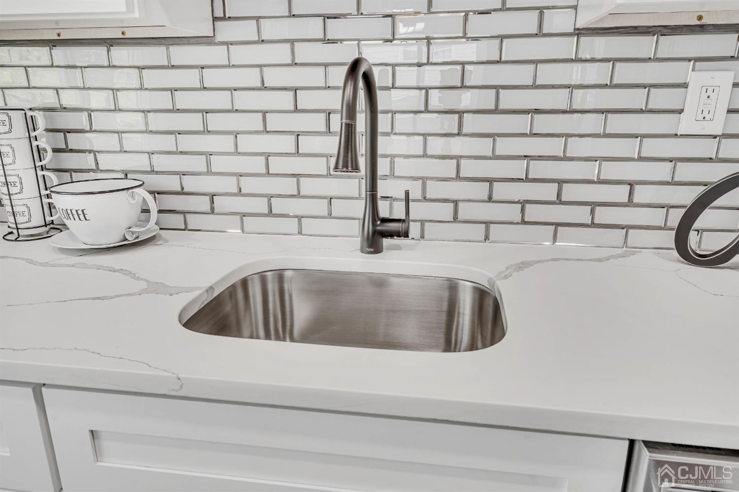 45 Harmon Road Edison, NJ 08837 - Photo 15 of 44 a kitchen with a sink and a stove