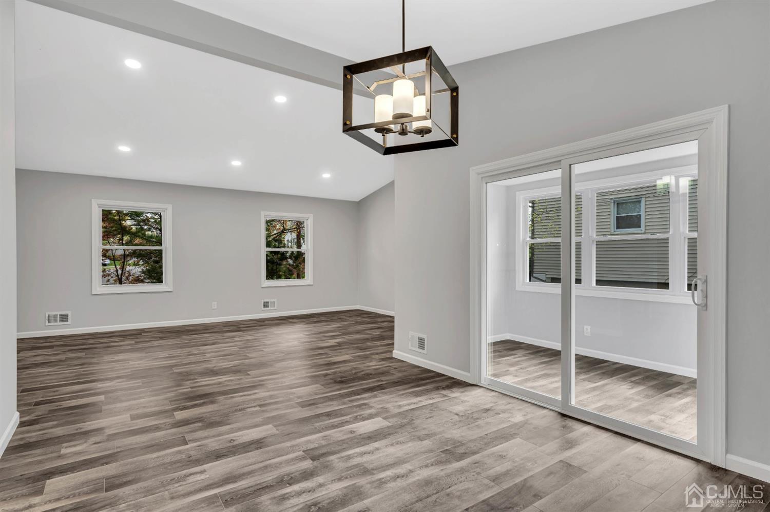 45 Harmon Road Edison, NJ 08837 - Photo 17 of 44 a view of a hallway with wooden floor and a large window