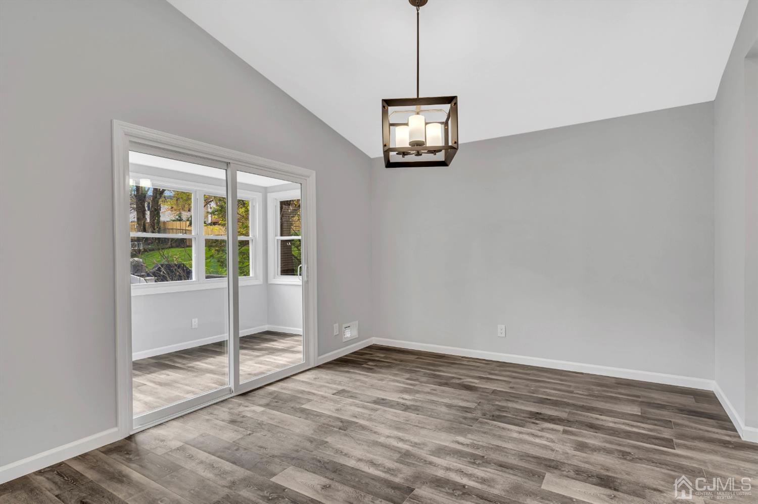 45 Harmon Road Edison, NJ 08837 - Photo 18 of 44 a view of empty room with window and ceiling fan