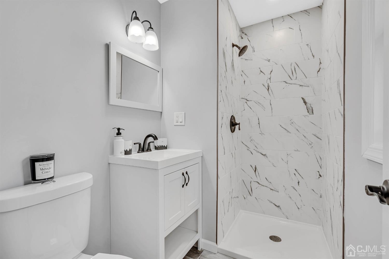 45 Harmon Road Edison, NJ 08837 - Photo 23 of 44 a bathroom with a sink a toilet and shower