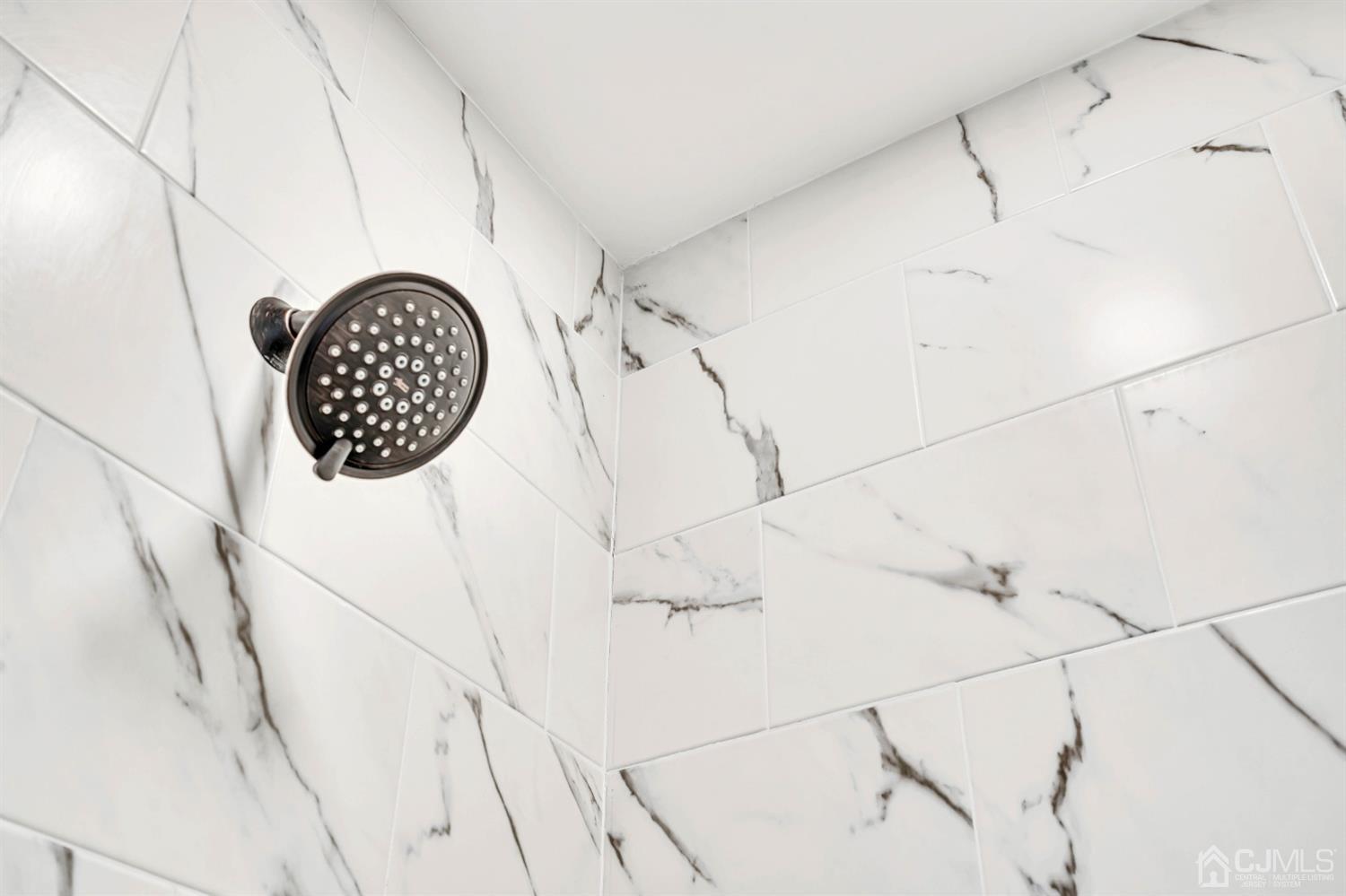 45 Harmon Road Edison, NJ 08837 - Photo 24 of 44 a bathroom with a sink and glass door