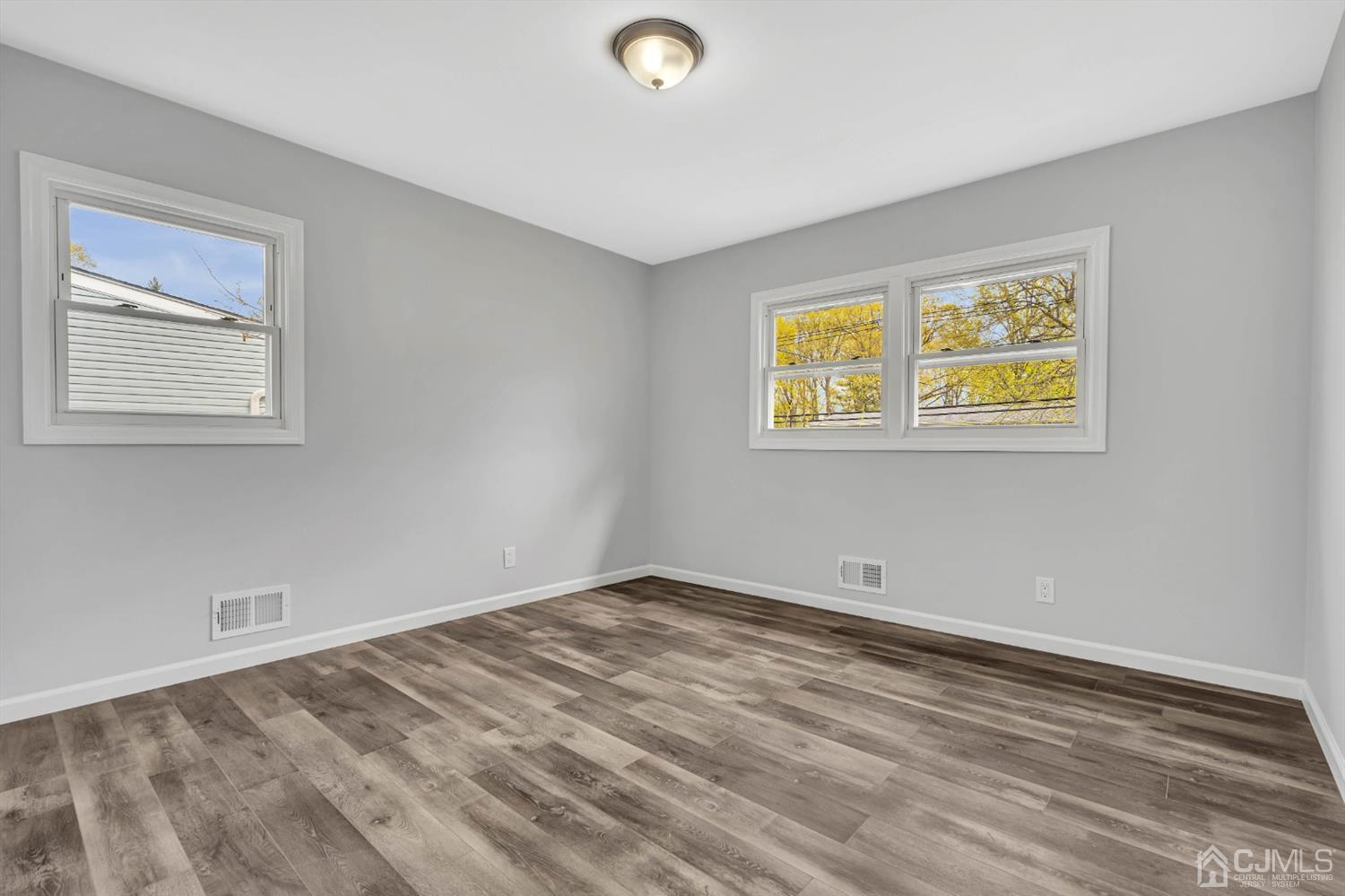 45 Harmon Road Edison, NJ 08837 - Photo 25 of 44 a view of room with window and ceiling fan
