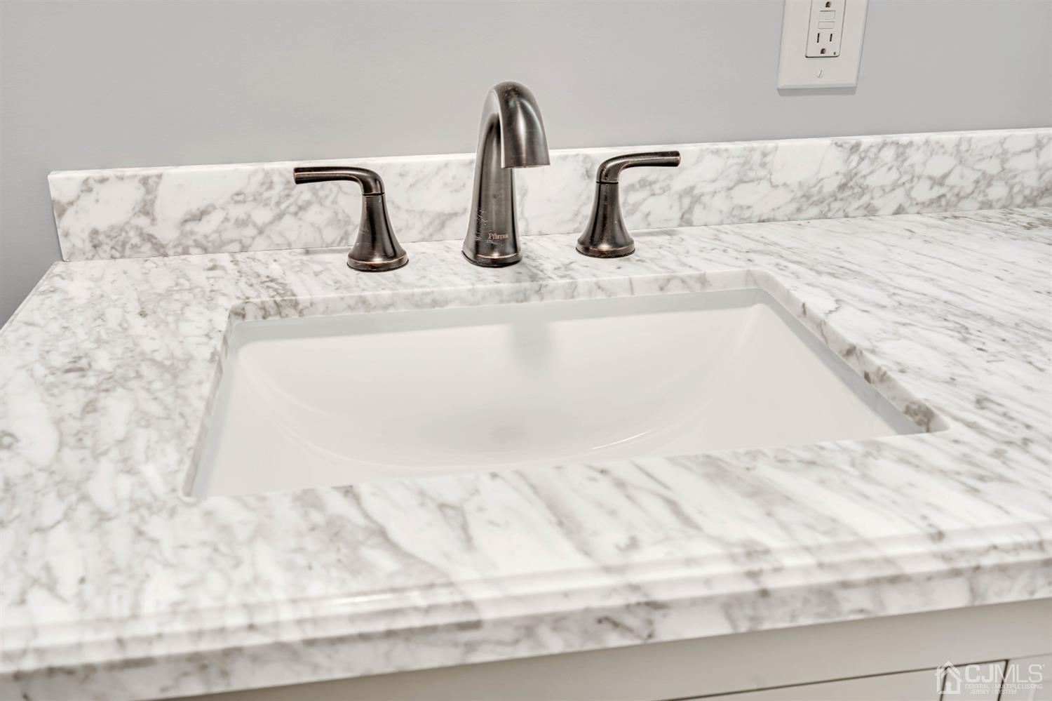 45 Harmon Road Edison, NJ 08837 - Photo 28 of 44 a close view of sink and tap