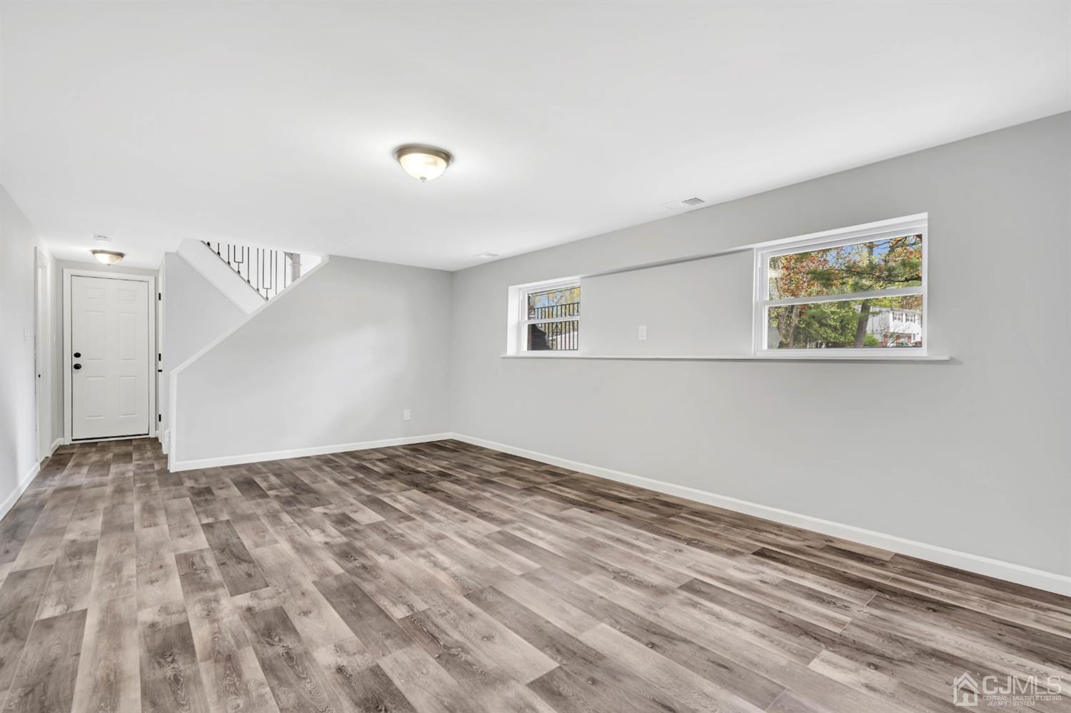45 Harmon Road Edison, NJ 08837 - Photo 31 of 44 a view of empty room with wooden floor